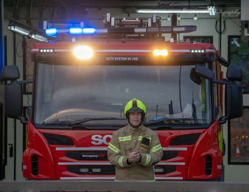 Fireman doing the first clap for NHS outside the Fire Station